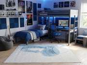 5' x 7' ivory and dusty blue abstract modern rectangular area rug styled in a modern bedroom with a loft bed and desk setup.