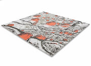 5' x 7' multi color woodland branches rectangular area rug with an abstract branch and berry pattern on a light neutral background.