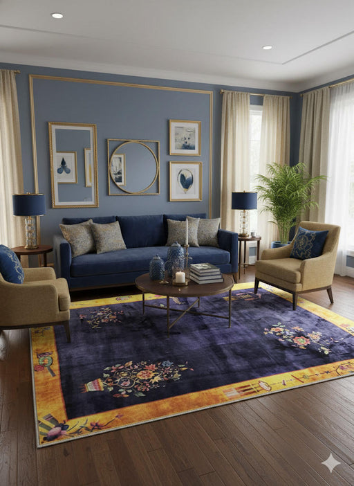 5' x 7' navy blue gold yellow floral accents border rectangular area rug styled in a classic living room with a blue sofa, neutral chairs, and dark wood flooring.