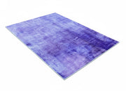 5' x 7' purple soft blue & gray tonal modern abstract rectangular area rug shown flat with a smooth, layered tonal texture and subtle abstract color variation.