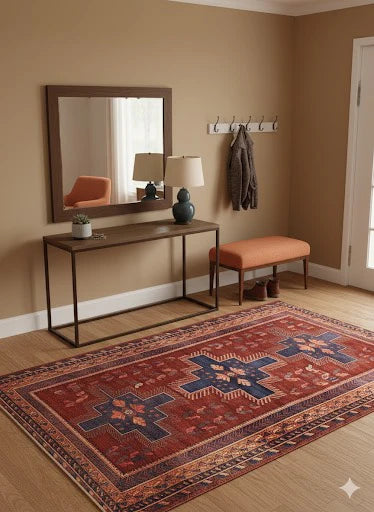 5' x 7' rectangle red multi color southwestern geometric area rug styled in a warm entryway with a slim console table, cushioned bench, and light wood flooring.