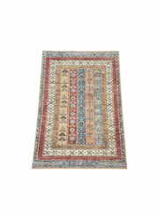 5' x 7' rectangular multicolor geometric distressed traditional area rug featuring layered stripe motifs and a bordered design on a clean white background.