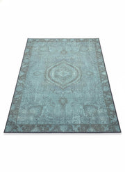 5' x 7' teal blue distressed traditional area rug featuring subtle vintage detailing with a washable non-slip backing.