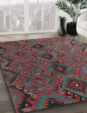 5' x 8' Brown Red Contemporary Southwestern Area Rug angled close-up displaying the detailed woven geometric pattern and color variation.