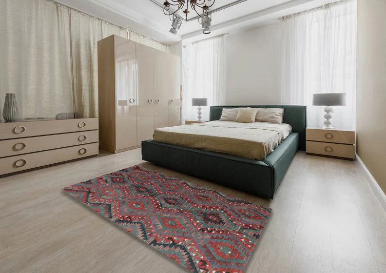 5' x 8' Brown Red Contemporary Southwestern Area Rug styled in a bedroom setting, demonstrating how the warm red and brown palette complements modern interiors.