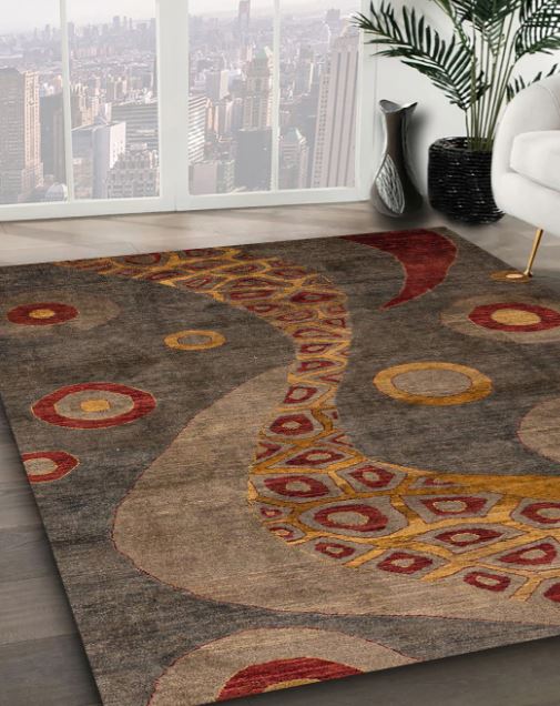 5' x 8' Dark Gold Brown Multi Color Abstract Oriental Area Rug angled close-up showcasing the layered geometric and circular pattern details.