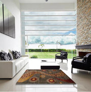 5' x 8' Dark Gold Brown Multi Color Abstract Oriental Area Rug styled in a modern living room, highlighting the bold abstract curves and circular accents.