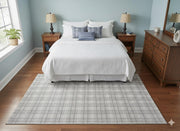 5' x 8' Light Gray Ivory Soft Beige Textured Grid Modern Rectangular Area Rug styled in an elegant bedroom with wood nightstands.