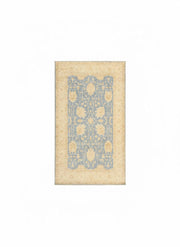 5' x 8' Rectangular Blue & Beige Cream Floral Traditional Area Rug placed in a cozy room with natural lighting.