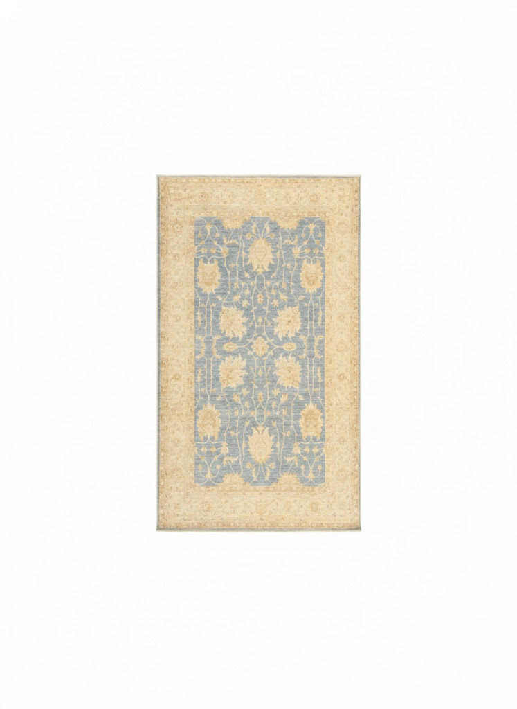 5' x 8' Rectangular Blue & Beige Cream Floral Traditional Area Rug placed in a cozy room with natural lighting.