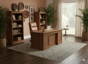 5' x 8' Rectangular Blue Beige Ivory Geometric Tribal Area Rug placed in a home office space demonstrating the subtle blue and ivory pattern within a modern workspace.