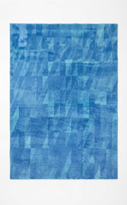 5' x 8' Rectangular Blue & Light Blue Abstract Geometric Modern Area Rug featuring layered geometric shapes and textured blue tones.