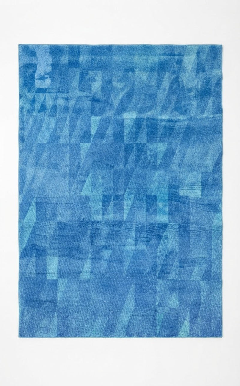 5' x 8' Rectangular Blue & Light Blue Abstract Geometric Modern Area Rug featuring layered geometric shapes and textured blue tones.