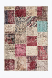 5' x 8' Rectangular Burgundy Pink & Beige Distressed Patchwork Vintage Area Rug featuring multicolor patchwork squares with faded floral motifs in burgundy, pink, teal, beige, and gray.