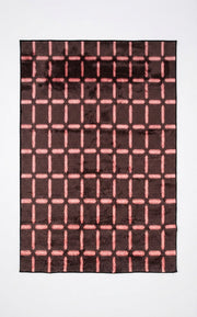 5' x 8' Rectangular Dark Brown & Blush Pink Geometric Grid Modern Area Rug featuring repeating blush pink dashed grid lines on a dark brown background.