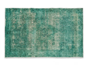 5' x 8' Rectangular Emerald Green & Sage Green Distressed Abstract Modern Area Rug featuring blended green tones, subtle faded details, and a textured vintage-inspired finish.