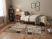 5' x 8' Rectangular Ivory Beige & Black Distressed Tribal Floral Medallion Vintage Traditional Area Rug placed beneath a wooden bed with white bedding and a sage green throw blanket.
