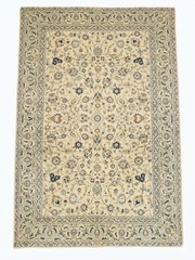 5' x 8' Rectangular Ivory Blue Floral Traditional Oriental Area Rug isolated on a white background.