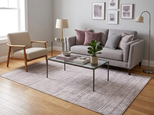5' x 8' Rectangular Light Gray & Ivory Distressed Linear Modern Area Rug styled in a living room with a gray sofa and glass coffee table.