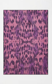 5' x 8' Rectangular Pink & Purple Animal Print Modern Contemporary Area Rug featuring bold leopard-inspired spots and an abstract animal pattern.