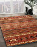5' x 8' Rectangular Red Multi Color Contemporary Oriental Area Rug styled in a bright modern living room with large windows and neutral décor.
