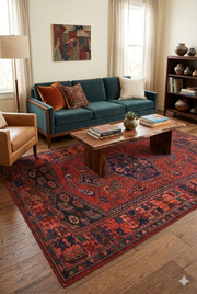 5' x 8' Rectangular Red & Navy Tribal Geometric Traditional Washable Area Rug styled in a living room with a sofa, accent chairs, and warm-toned decor.