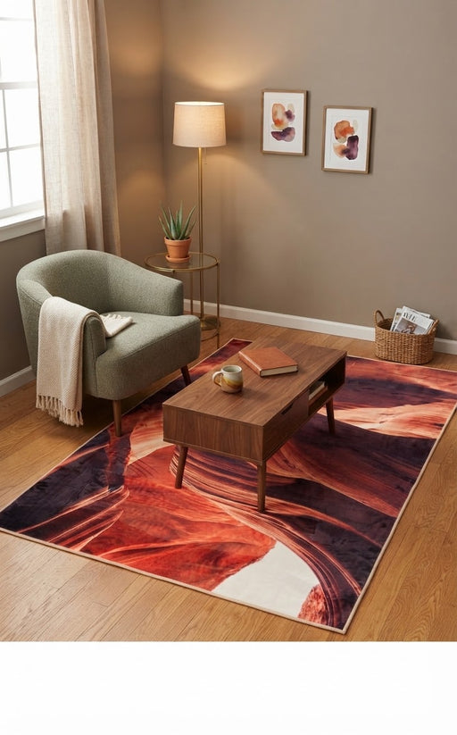 5' x 8' Rectangular Rust Orange & Burgundy Abstract Canyon Modern Area Rug styled in a living room with a sage green accent chair and wooden coffee table.