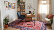 5' x 8' Rectangular Rust Red & Navy Blue Distressed Floral Medallion Vintage Traditional Area Rug styled in a home office with a wooden desk and navy upholstered office chair.