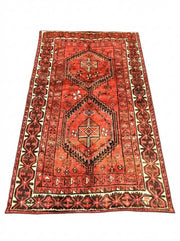 5' x 8' Red Espresso Brown Muted Black Vintage-Inspired Tribal Area Rug displayed on a light neutral background.