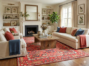 5' x 8'  Rich Red Cream Muted Blue Traditional Floral Area Rug placed in a cozy living room with neutral-colored furniture, vibrant throw pillows, 
and a relaxed modern vibe.