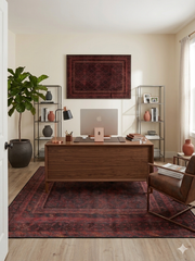 5' x 8' rectangular burgundy & black distressed tribal traditional area rug styled in a home office with a wooden desk and modern shelving.