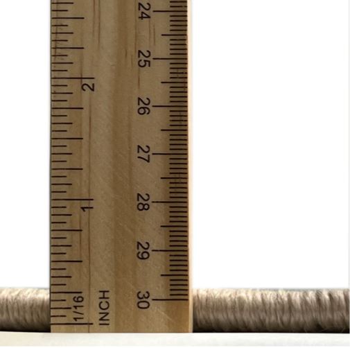 5ft Round Desert Sand Beige Pink Traditional Medallion Area Rug thickness measurement image displaying the low-profile pile height next to a ruler for scale.