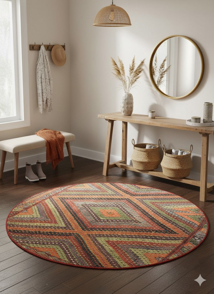 6' Round Multi Color & Rust Geometric Distressed Bohemian Area Rug placed in entryway under wooden console table.