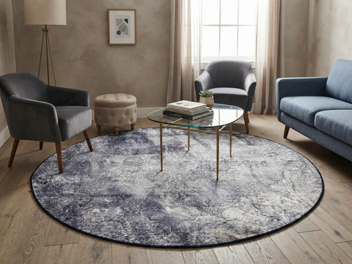 6' Round Navy Blue Gray Distressed Floral Vintage Area Rug styled in a living room with a blue sofa and glass coffee table.