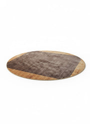 6 ft round area rug featuring a brown center with a tan light wood tone solid border in a modern minimalist design.