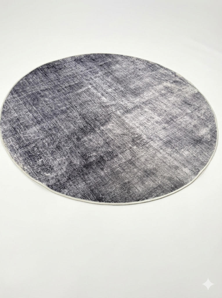 6' round charcoal ivory light beige distressed modern area rug featuring a subtle abstract textured pattern with soft tonal variation.