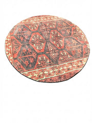 6' round deep rust red and charcoal black southwestern geometric area rug featuring bold tribal-inspired diamond and border patterns.