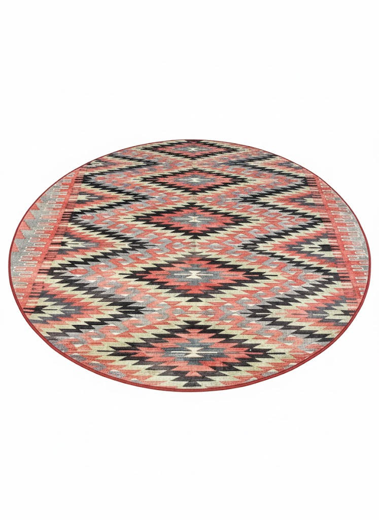 6' round rust & cream southwestern geometric area rug displayed on a light neutral background.