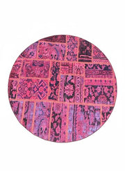 6' x 6' Round Pink & Purple Distressed Patchwork Bohemian Area Rug displayed in an isolated product setting on white background.