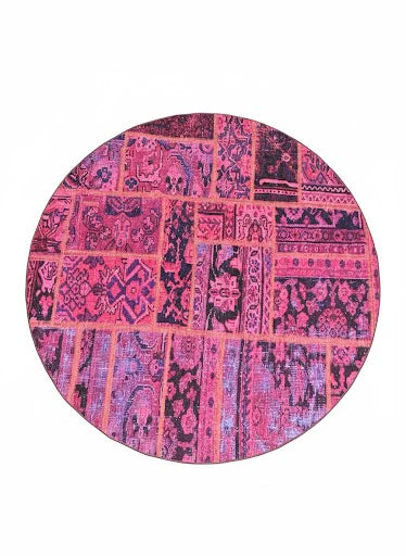 6' x 6' Round Pink & Purple Distressed Patchwork Bohemian Area Rug displayed in an isolated product setting on white background.