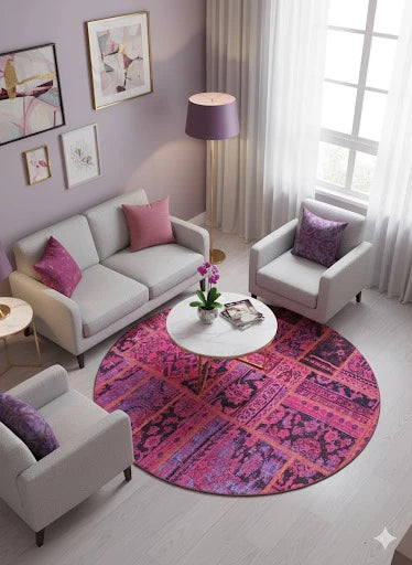 6' x 6' Round Pink & Purple Distressed Patchwork Bohemian Area Rug styled in a cozy living room seating area.