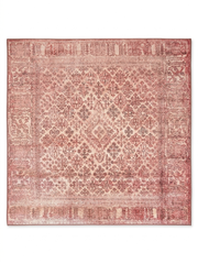 6' x 9' Rectangular Red & Pink Distressed Abstract Modern Area Rug styled in a dining room with a wooden table and upholstered chairs.