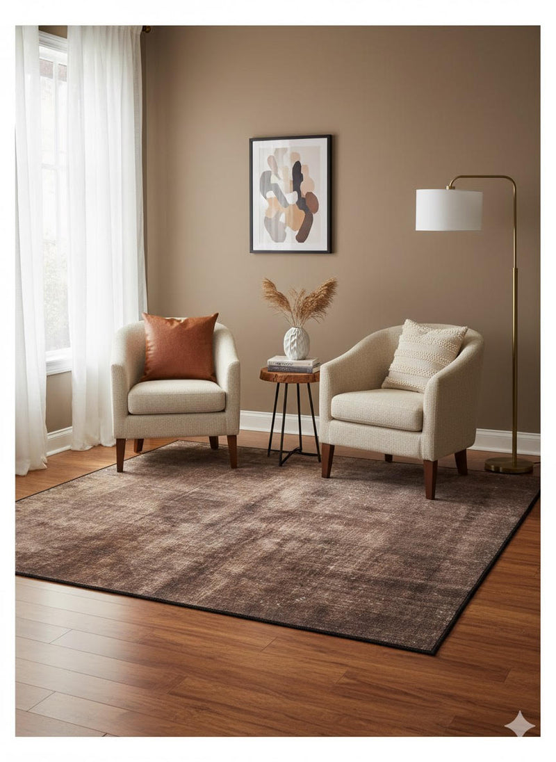 6' x 6' Square Brown Beige Distressed Solid Modern Area Rug placed in a cozy seating area highlighting the soft neutral colors and minimalist modern design.