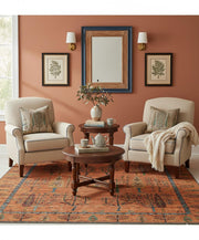 6' x 6' Square Rust Orange Multi Color Tree of Life Botanical Motif Tribal Area Rug placed in a cozy seating area highlighting the artistic tree of life pattern and earthy multi-color accents.