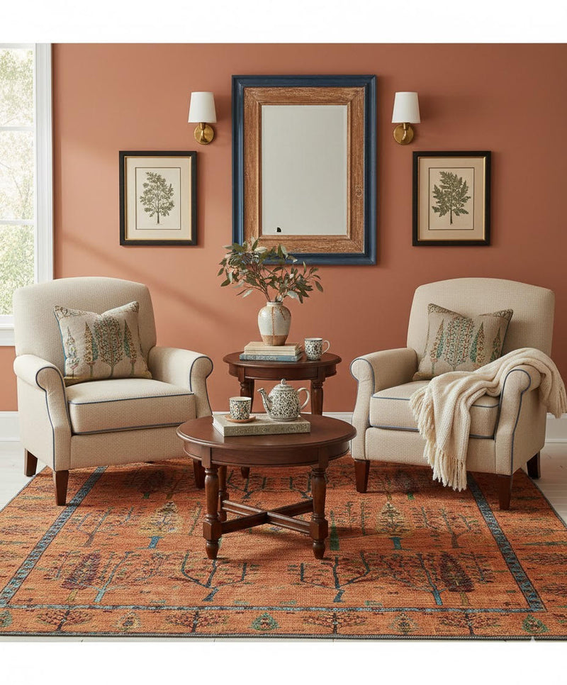 6' x 6' Square Rust Orange Multi Color Tree of Life Botanical Motif Tribal Area Rug placed in a cozy seating area highlighting the artistic tree of life pattern and earthy multi-color accents.