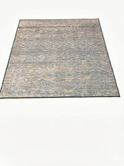 6' x 6' square blue gray distressed textured washable area rug featuring subtle beige and taupe accents with a non-slip backing.