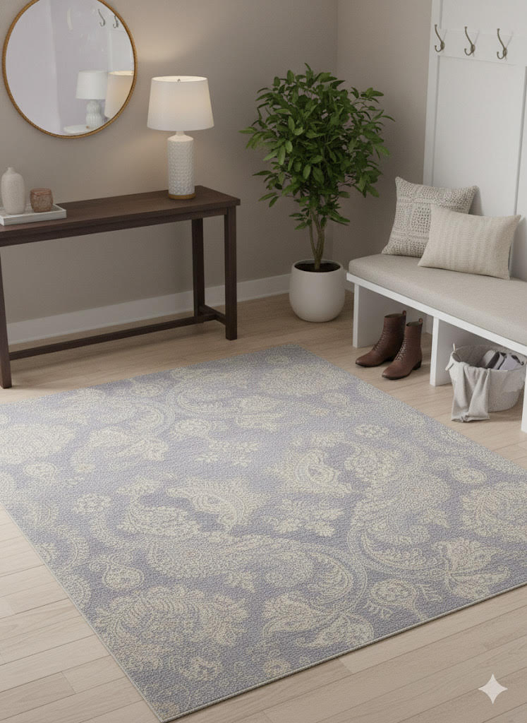 6' x 6' square blue, ivory, and gray tonal damask transitional area rug styled in an entryway with a console table, round mirror, and neutral seating bench.