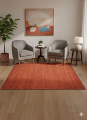 6' x 6' square burnt orange modern washable area rug styled in a cozy sitting area with two armchairs, a small round table, and warm neutral décor.