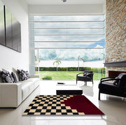 6' x 9' Abstract Dark Almond Brown Modern Area Rug displayed in a bright modern living room, showcasing the artistic abstract layout and contemporary appeal.