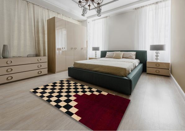 6' x 9' Abstract Dark Almond Brown Modern Area Rug styled in a contemporary bedroom, featuring a bold checkerboard pattern with a contrasting deep red abstract section.
